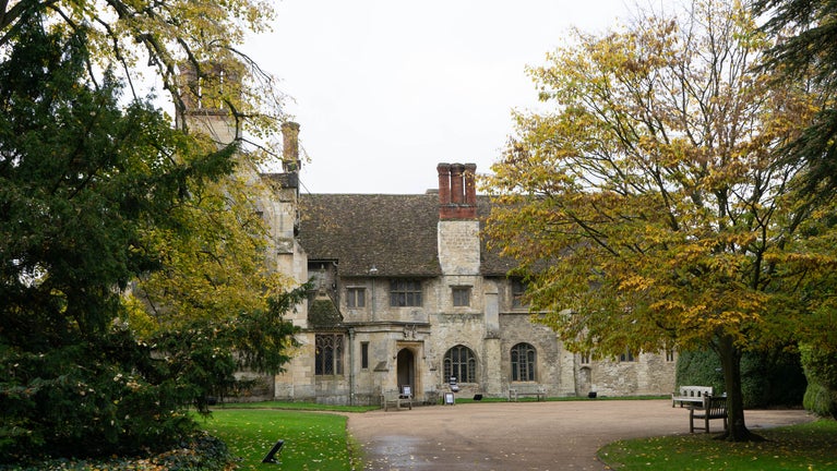 An autumnal view of the turning circle by the house at Anglesey Abbey.
